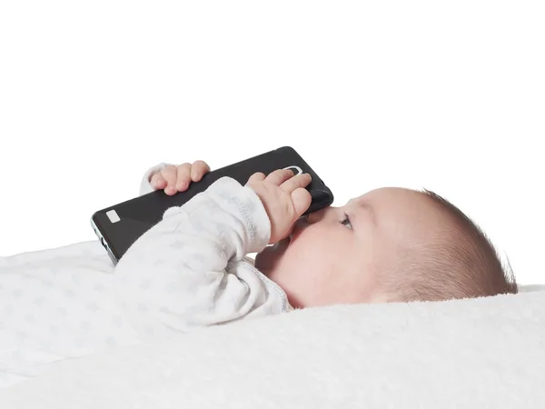 Liten pojke håller smartphone isolerade Stockfoto