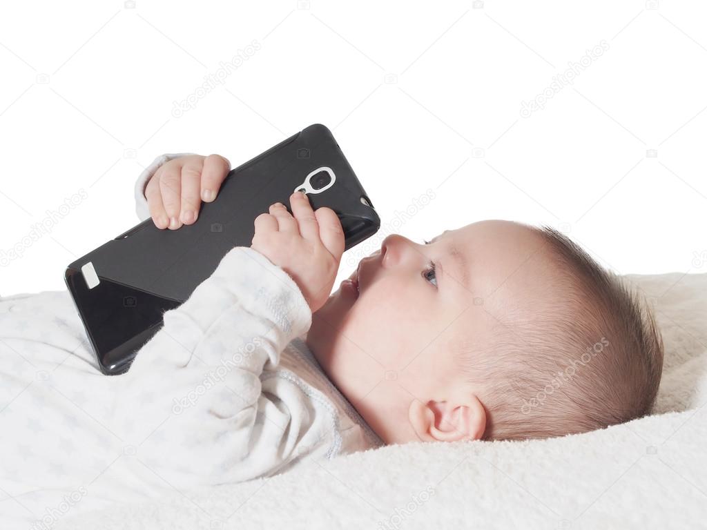 Small baby boy holding smartphone isolated