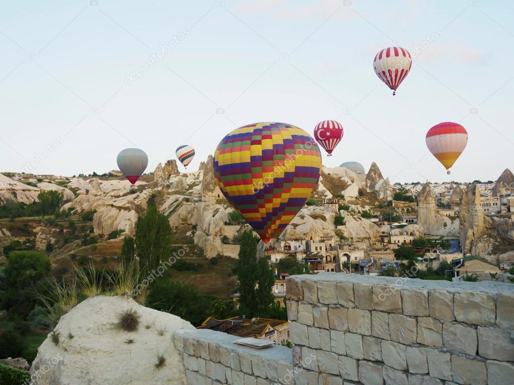 Hot air balloons over landscape at Cappadocia, Turkey, Goreme