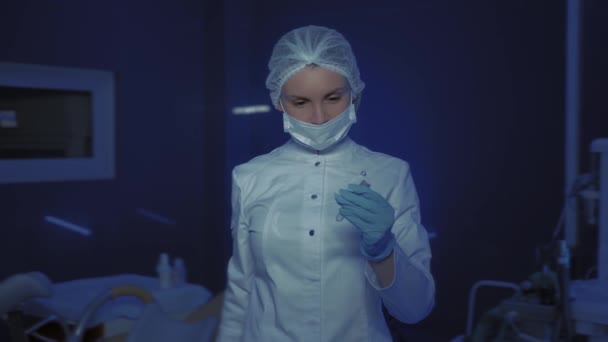 Portrait of Young Female Doctor in Medical Mask Looking at Camera. Stop coronavirus. Health — Stock Video