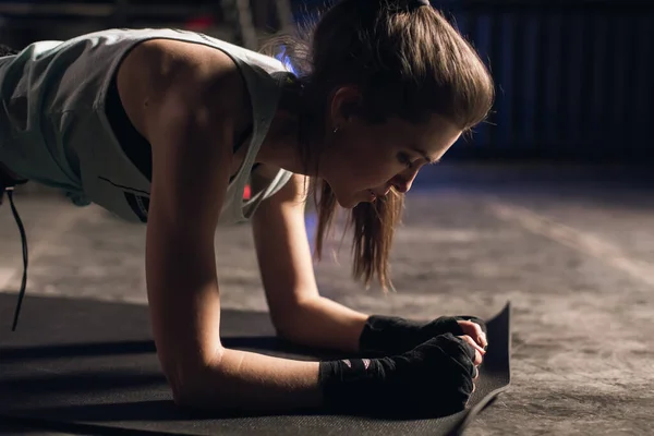 Young girl doing sports in the gym. Atmospheric gym Royalty Free Stock Images