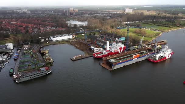 Schellingwoude, North-Holland, The Netherlands - 16-01-2021 Schellingwoude Aerial view of a shipyard along the river Ij Near Amsterdam. — Stock Video