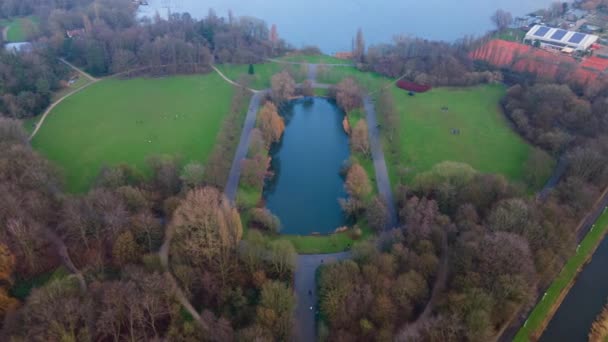 The Flevopark in Amsterdam East North-Holland The Netherlands aerial hyperlapse of people enjoying a walk in the park on a sunday. — Stock Video