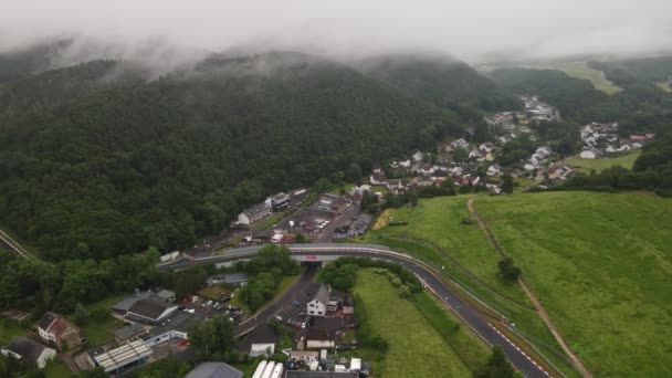 Adenau Germany, Race track air drone view in the Eifel в похмурий день. — стокове відео