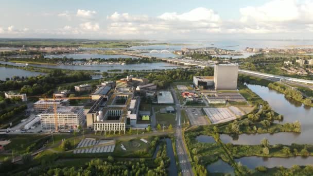 Amsterdam, 8th of August 2021, Aerial view of Amsterdam science park in East part of amsterdam, university campus and datacenter fly over — Stock Video