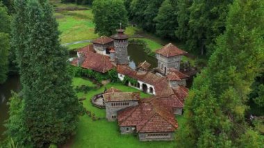 Turrelbach Castle in Mertzig, Luxembourg. Aerial drone footage in summertime