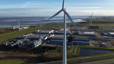 Large data center in the Eemshaven, Groningen. Infrastrucutre for AI, internet tehcnology and cloud servcies. Aerial drone video.