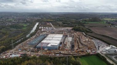 Exterior overview of a large scale artificial intelligence data center undergoing construction in Farciennes, Belgium. This video captures the development phase of a mega investment in digital infrastructure, symbolizing global technology growth and