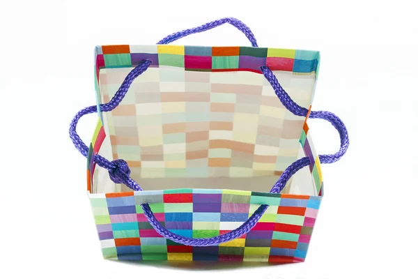 Разноцветная открытая подарочная сумка на белом — стоковое фото