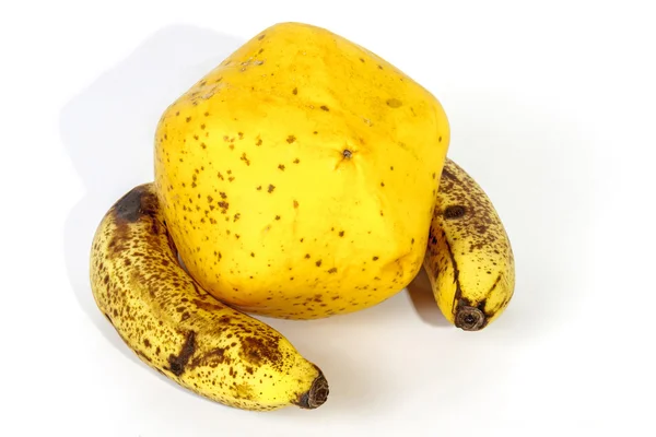 Yellow Paw Paw with Two Ripe Speckled Bananas — Stock Photo, Image