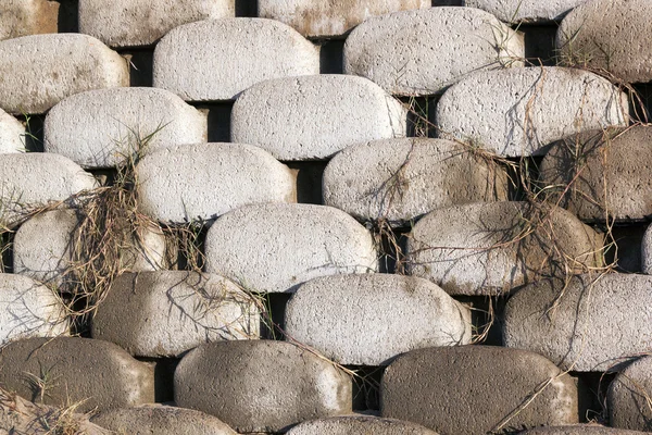 Vzory a textury zakřivené zámkové betonové udržení — Stock fotografie