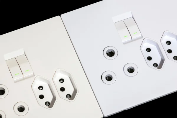 Beige and White Multiplug Sockets and switches — Stock Photo, Image