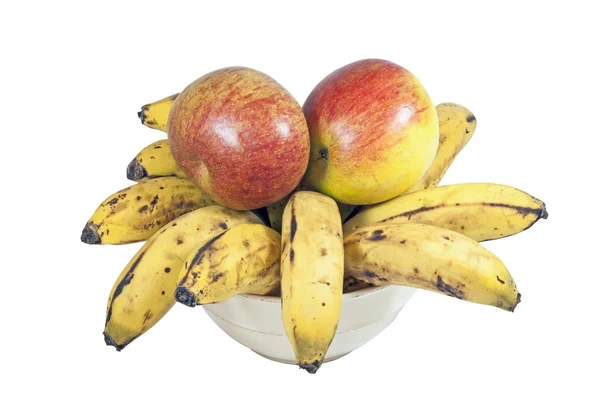 Gelbe Bananen und rote Äpfel in weißer Schüssel — Stockfoto