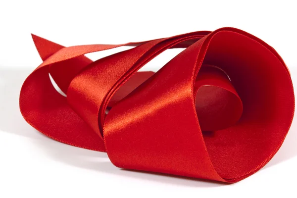 Roll of Unfolding Shiny Red Silk Ribbon — Stock Photo, Image