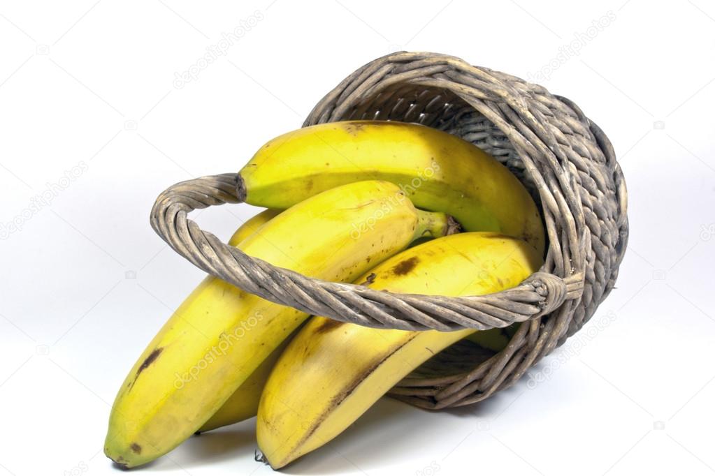 Four Yellow Bananas in an Upturned Wicker Basket