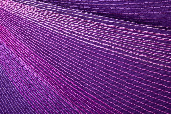 Colorful Stitching Forming Pattern on Mauve Fabric — Stock Photo, Image