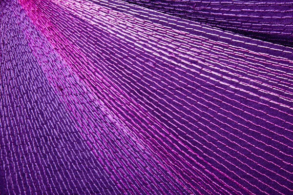 Intricate Colorful Stitching Forming Pattern on Mauve Fabric — Stock Photo, Image