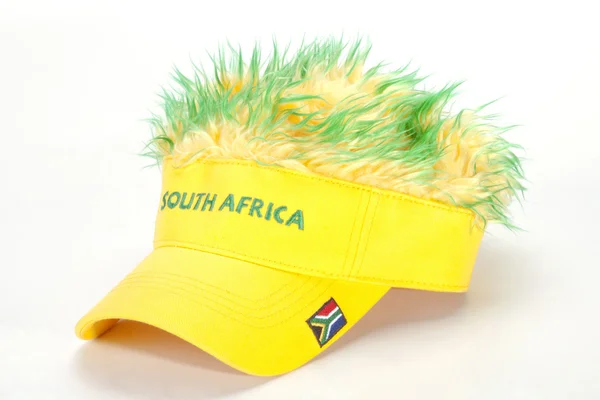 South African Peak Cap with Flag and Artificial Hair — Stock Photo, Image