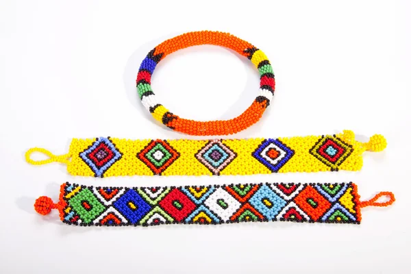 Two Brightly Colored Zulu Wristbands with Beaded Armband — Stock Photo, Image