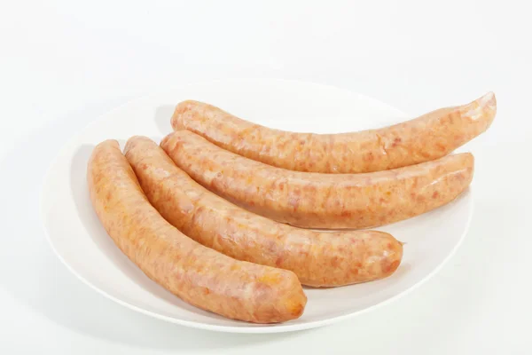 Four Cheesy Russian Sausages on White Plate — Stock Photo, Image