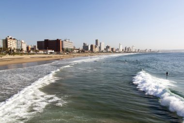  People on Beach Against Durban City Skyline 