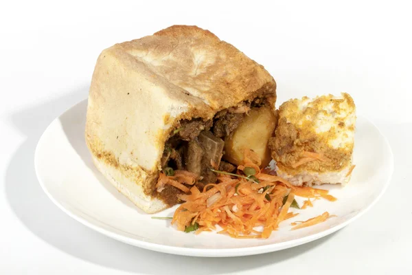 Geleneksel Durban Bunny Chow köri sos gösterilen batırılmış ekmek