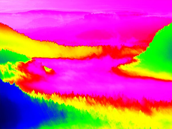 Infrared scan of rocky landscape, pine forest with colorful fog, hot sunny sky above. Amazing thermography colors.