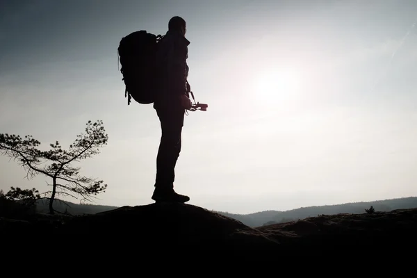 Amateur photographer takes photos with mirror camera on neck.  Dreamy foggy landscape — Stock Photo, Image