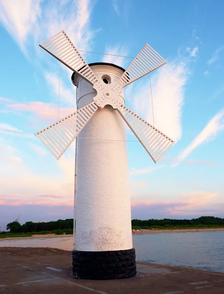 White windmill by sea on rocky coast. Seascape and landscape — Stock Photo, Image