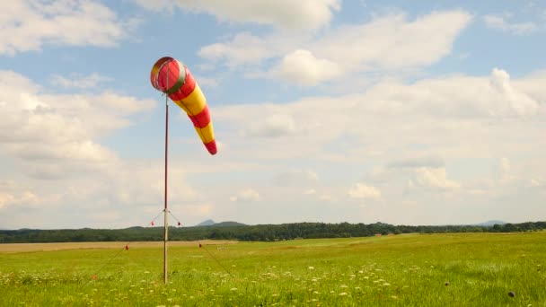Summer hot day on sport airport with abandoned windsock, wind is blowing and windsock is moving — Stock Video