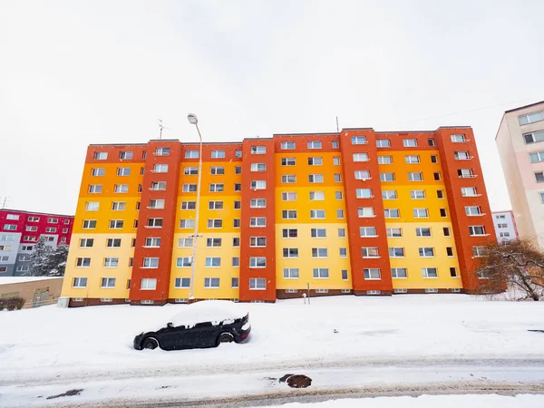 Prefabricated building in winter time. Typical town suburban architecture with snow cover