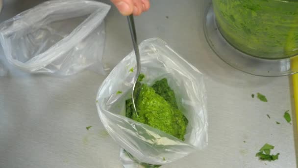 Filling Plastic Bag Chopped Herbs Fresh Pesto Spoon Fills Freezer — Stock Video