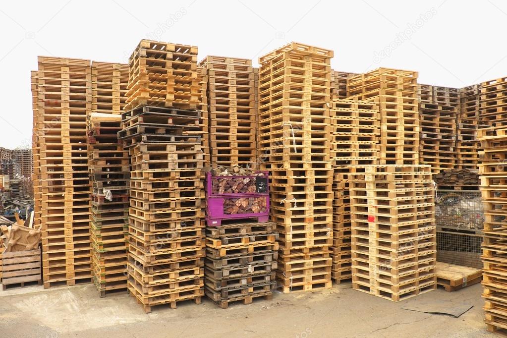 Stock of repaired wooden euro pallets at transportation company.