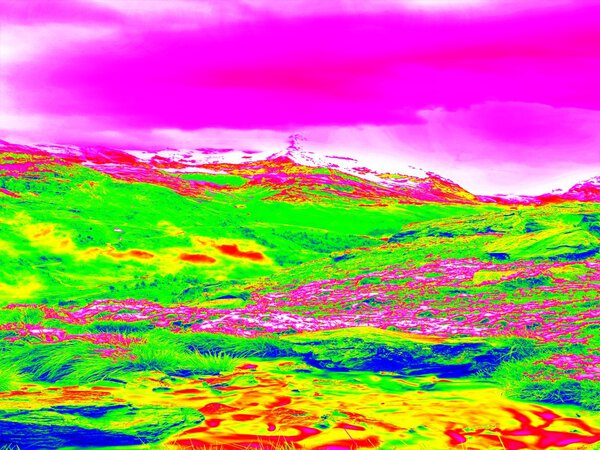Alpine spring mountain path in infrared photo. Hilly landscape in background. Sunny weather with clear sky above. Amazing thermography colors.