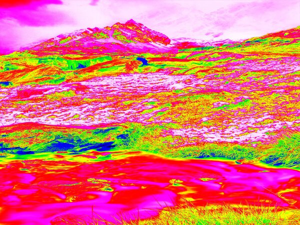 Alpine spring mountain path in infrared photo. Hilly landscape in background. Sunny weather with clear sky above. Amazing thermography colors.