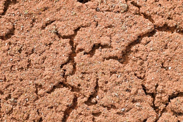 Old dry red crushed bricks surface on outdoor tennis ground. Detail of texture — Stock Photo, Image