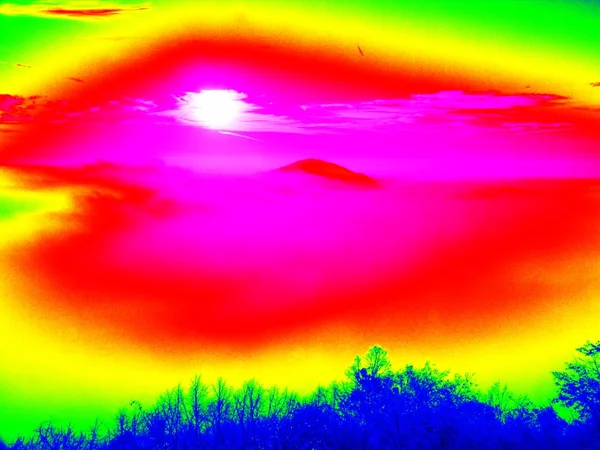 Fantastic infrared scan of hilly landscape. Hill and forest with colorful fog, hot sunny sky above. Grunge background in amazing thermography colors. animal view. — Stock Photo, Image