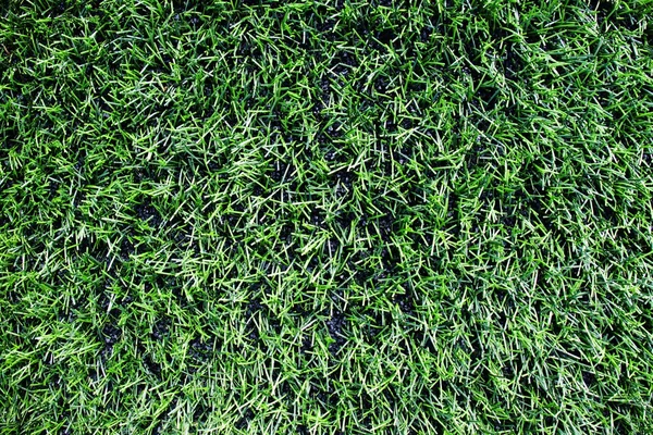 Detail of  plastic grass, artificial green turf texture background — Stock Photo, Image