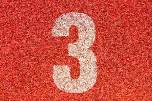 Akvarell färg. Färg effekt. Vita spårnummer tre på röd gummi travet, kör tävlingsbanor i liten stadion — Stockfoto