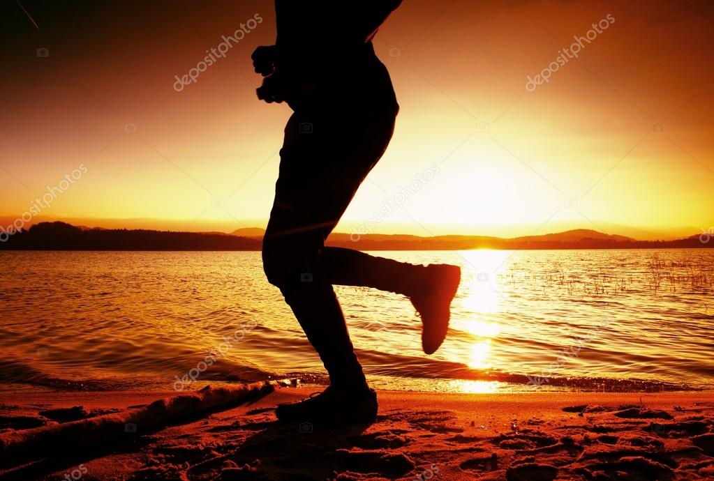 cruise Invalid Thoroughly Training at sunset. A silhouette of jogger at path along lake coastline.  Stock Photo by ©rdonar 94407966
