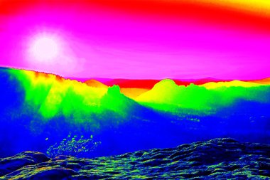 Fantastic infrared scan of rocky landscape, pine forest with colorful fog, hot sunny sky above. Grunge amazing thermograph