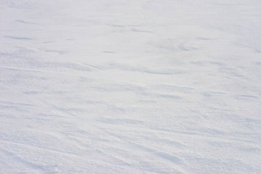 Kar, doku, kar taneli beyaz yüzey. Güzel kış arkaplanı.