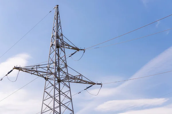 High voltage electric transmission pylon tower.Electricity concept Close up high voltage power lines station. High voltage electric transmission pylon.