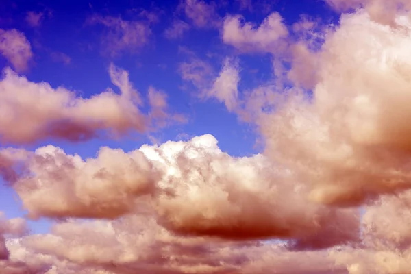 white fluffy clouds in the blue sky background.Blue cloudy white sky in the nice blue heaven sky.Toned.
