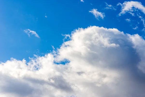 white fluffy clouds in the blue sky background.Blue cloudy white sky in the nice blue heaven sky.