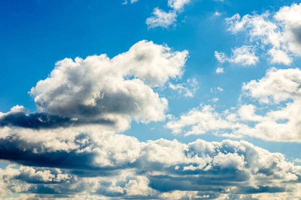 white fluffy clouds in the blue sky background.Blue cloudy white sky in the nice blue heaven sky.