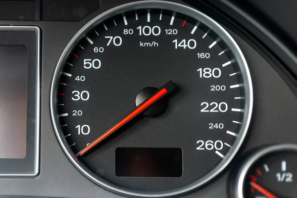 Speedometer in a car. Car dashboard. Dashboard details with indication lamps.Car instrument panel. Dashboard with speedometer.Car detailing. Modern interior.Closeup.Copy space.