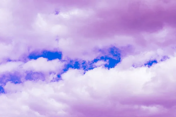 Purple clouds with beautiful blue sky,on the heaven.Amazing nature background.Toned.