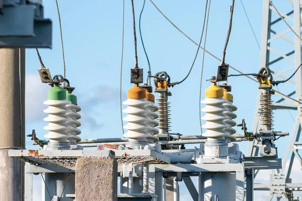 High voltage electric generator insulators.Detail of high voltage circuit breaker in a power substation.high voltage circuit breaker in a power substation on a summer day.Closeup.