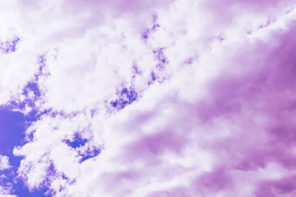 Purple clouds with beautiful blue sky,on the heaven.Amazing nature background.Toned.